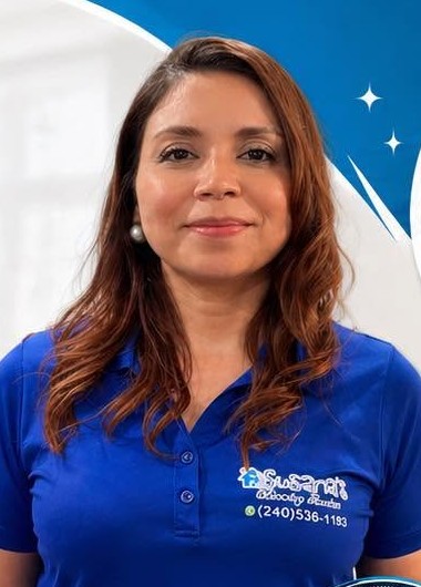Susana, owner of Susana's Cleaning Services, in her blue company polo